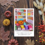 Листівка "Кіт в книгарні"